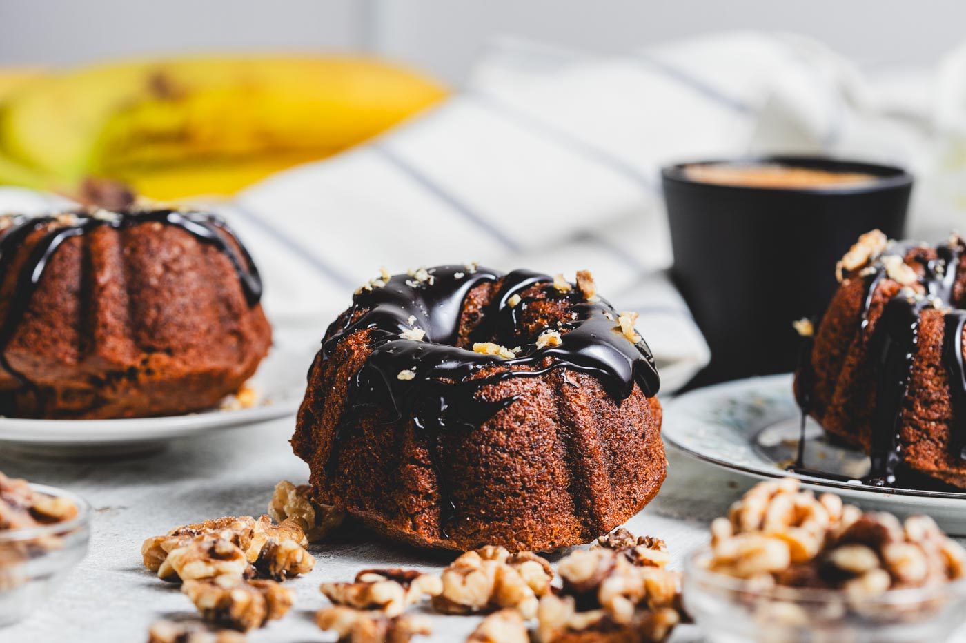 Mini banana bundt cakes with chocolate glaze and walnuts